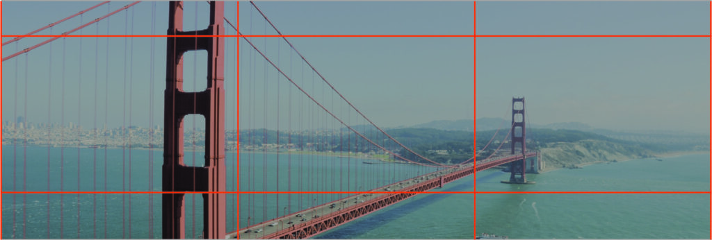 A view of the Golden Gate Bridge spanning across the water with the cityscape of San Francisco in the background. The bridge's iconic red towers and supporting cables are prominent, with hills and coastline extending into the distance – a perfect slide for a pitch deck presentation.