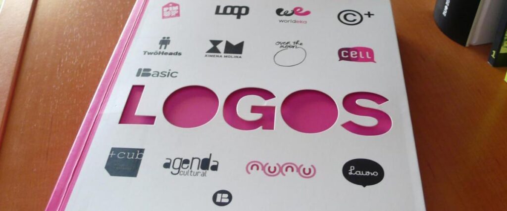 A white book with a pink spine labeled "LOGOS" on the cover. The word "LOGOS" is cut out, revealing the pink page underneath. Surrounding the word are various company logos such as Loop, TwoHeads, we worldeva, and others—ideal for use in a presentation slide template.